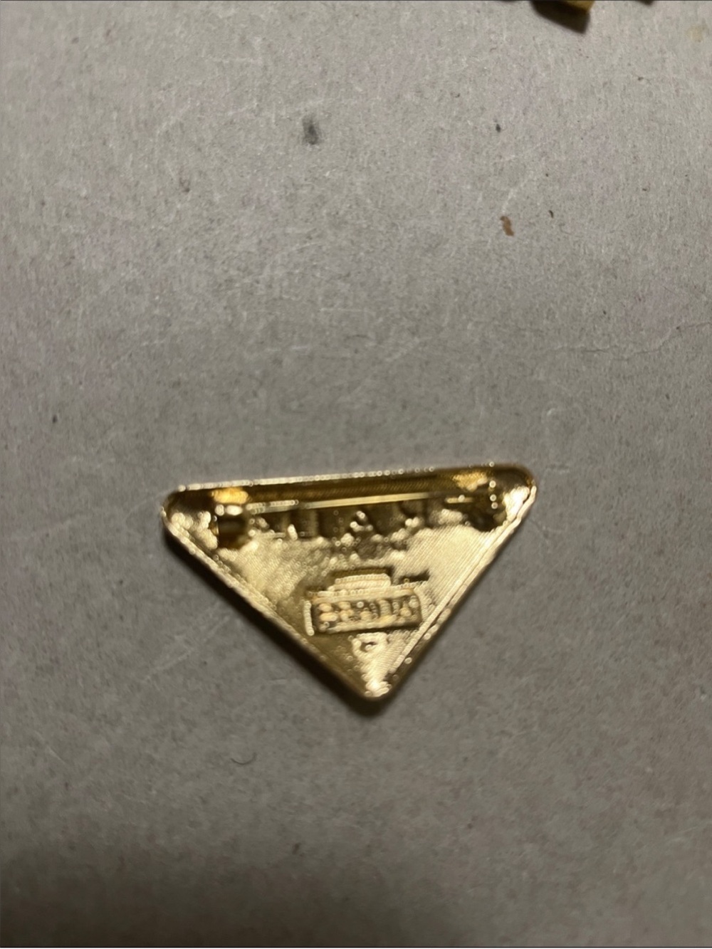 Prada White Enamel Triangle Logo Pin with Gold Accents - Picture 3 of 3